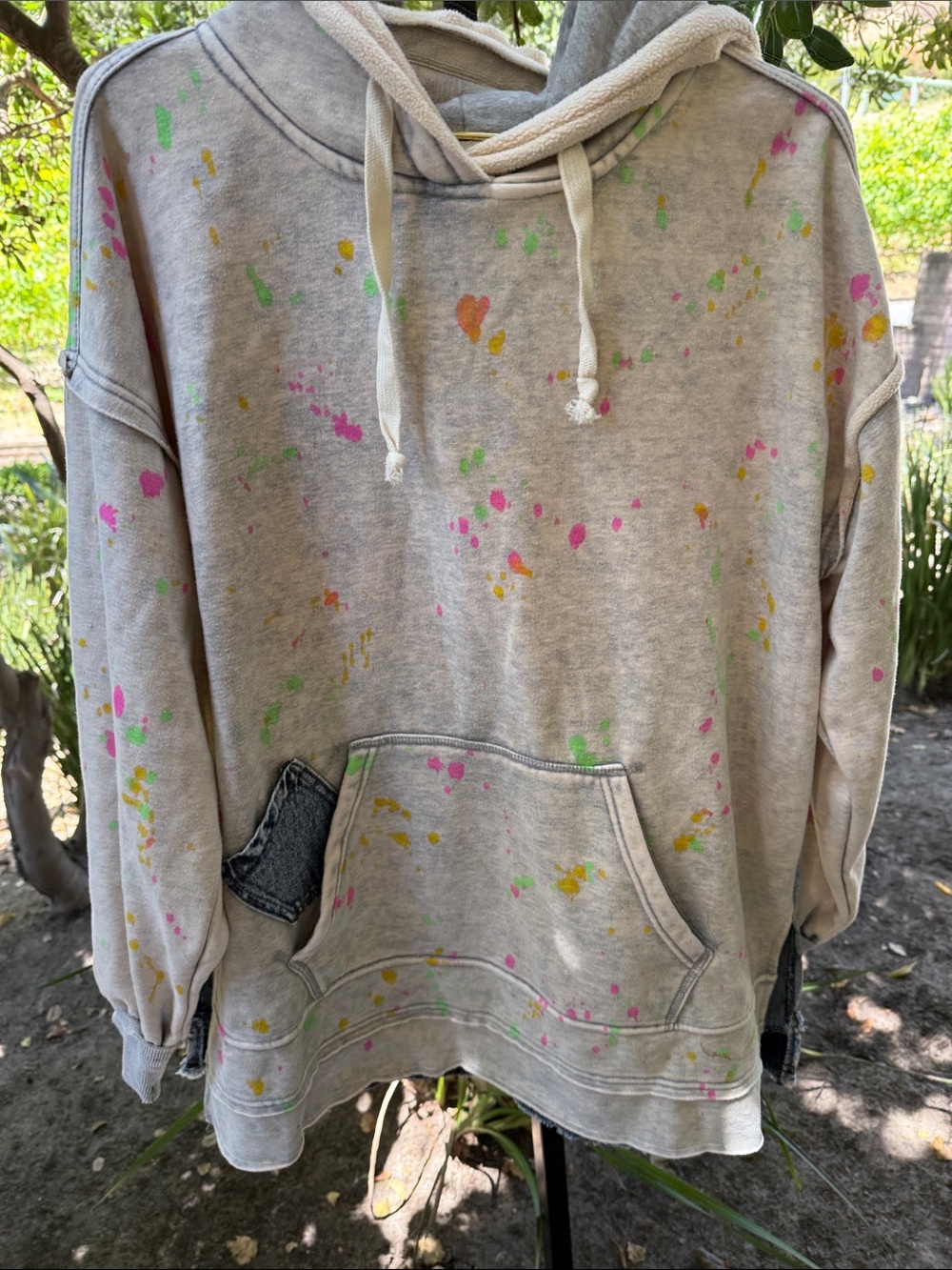 Oli & Hali Beige Hoodie with Neon Paint Splatter (Pink, Green, Yellow) runs big.